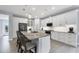 Stylish kitchen with a large island, stainless steel appliances, and white cabinets, offering ample storage space at 7499 Ashtabula St, Englewood, FL 34224
