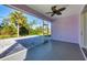 Enclosed lanai with a ceiling fan, providing an indoor-outdoor living experience at 7499 Ashtabula St, Englewood, FL 34224