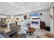 Open-concept living area connecting the kitchen and living room, featuring modern amenities and comfortable seating at 7499 Ashtabula St, Englewood, FL 34224