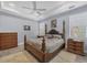 Beautiful main bedroom with tray ceiling, natural light, and ample space at 7499 Ashtabula St, Englewood, FL 34224