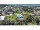 Aerial view of a charming home with a private pool nestled along a scenic canal at 8164 Archie St, Englewood, FL 34224
