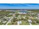 Expansive aerial view showcasing the neighborhood, nearby lakes, and surrounding natural landscape at 8164 Archie St, Englewood, FL 34224