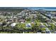 Stunning aerial perspective captures canal-front property with lush landscaping and private pool at 8164 Archie St, Englewood, FL 34224