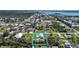 Aerial view of property with inviting backyard pool and canal access to the Intracoastal Waterway at 8164 Archie St, Englewood, FL 34224