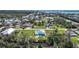 An aerial shot showcases a home with a pool and a beautiful canal-front location at 8164 Archie St, Englewood, FL 34224