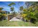 Backyard deck with a wooden rocking bench at 8164 Archie St, Englewood, FL 34224