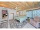 Charming bedroom featuring a cozy bed, patterned curtains, and a ceiling fan for added comfort at 8164 Archie St, Englewood, FL 34224
