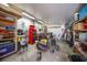 Garage with tools, shelving, and equipment, offering ample space for storage and projects at 8164 Archie St, Englewood, FL 34224