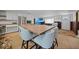 A spacious kitchen featuring a large island, butcher block countertops, and stainless steel appliances at 8164 Archie St, Englewood, FL 34224