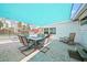 Inviting outdoor patio with dining furniture, covered by an awning, perfect for gatherings at 8164 Archie St, Englewood, FL 34224