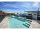 Backyard pool with brick pavers, safety fence, and bright blue water at 8164 Archie St, Englewood, FL 34224