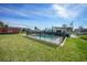 A fenced swimming pool in a well-maintained backyard, perfect for summer enjoyment at 8164 Archie St, Englewood, FL 34224