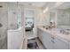 Elegant bathroom features granite countertops, double sinks, and a glass-enclosed shower at 8375 E Windbound Ct Ct, Sarasota, FL 34240