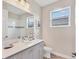 Stylish bathroom featuring granite counters, modern fixtures, and patterned tile flooring at 8375 E Windbound Ct Ct, Sarasota, FL 34240