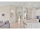 Open kitchen with quartz counters, stainless steel appliances, and access to the main hallway at 8375 E Windbound Ct Ct, Sarasota, FL 34240