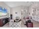 Bright living room with neutral decor, large window, and comfortable seating at 8375 E Windbound Ct Ct, Sarasota, FL 34240