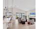 Open living space featuring a kitchen, dining, and living area with scenic views at 8375 E Windbound Ct Ct, Sarasota, FL 34240