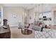 Cozy living room with neutral tones, modern furnishings, and an open layout at 8375 E Windbound Ct Ct, Sarasota, FL 34240