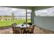 Charming screened-in patio with lake views, perfect for relaxing and entertaining guests at 8375 E Windbound Ct Ct, Sarasota, FL 34240