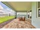 Screened-in lanai overlooking the scenic lake, perfect for enjoying the outdoors at 8375 E Windbound Ct Ct, Sarasota, FL 34240