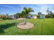 Large backyard with a palm tree as a focal point; plenty of room to add your own touches and enhancements at 9423 El Campo Ave, Englewood, FL 34224
