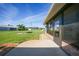Enjoy the spacious backyard, featuring well-maintained lawn and brick and concrete trim around the patio at 9423 El Campo Ave, Englewood, FL 34224