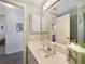 This bathroom offers a bright mirror over the vanity and updated fixtures at 9423 El Campo Ave, Englewood, FL 34224