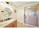 Clean bathroom featuring a single sink vanity and glass door shower at 9423 El Campo Ave, Englewood, FL 34224