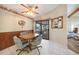 Dining area featuring wood paneling and sliding doors to an outdoor living area at 9423 El Campo Ave, Englewood, FL 34224