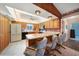 Charming kitchen with breakfast bar, tile floors, and a full suite of appliances at 9423 El Campo Ave, Englewood, FL 34224