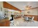 Bright kitchen with a breakfast bar, dining area, and ample cabinet space at 9423 El Campo Ave, Englewood, FL 34224
