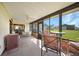 Relax in this spacious lanai and enjoy the view of the green yard beyond at 9423 El Campo Ave, Englewood, FL 34224