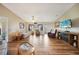 Cozy living room showcasing stylish decor, natural light, and hardwood flooring at 9423 El Campo Ave, Englewood, FL 34224