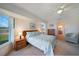 Bright bedroom with a ceiling fan and large windows allowing for plenty of natural light at 9423 El Campo Ave, Englewood, FL 34224