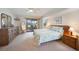 Comfortable bedroom with a ceiling fan, sliding glass door, and access to the backyard at 9423 El Campo Ave, Englewood, FL 34224