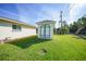 The home features a matching storage shed in the backyard at 9423 El Campo Ave, Englewood, FL 34224