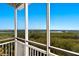 Screened lanai offering panoramic views of the surrounding landscape at 10310 Coral Landings Ct # 98, Placida, FL 33946