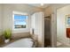Bathroom featuring a soaking tub with a view, a walk-in shower, and modern finishes at 10310 Coral Landings Ct # 98, Placida, FL 33946