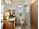 Well-lit bathroom with a glass block shower, granite countertops, and modern fixtures at 10310 Coral Landings Ct # 98, Placida, FL 33946