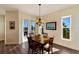 Cozy dining area with natural light and a view of the surrounding landscape at 10310 Coral Landings Ct # 98, Placida, FL 33946