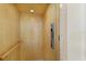 Interior of a private elevator, featuring wood paneling and handrail at 10310 Coral Landings Ct # 98, Placida, FL 33946