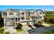 A spacious townhouse with a metal roof, multiple balconies, and attached garages, providing ample parking at 10310 Coral Landings Ct # 98, Placida, FL 33946