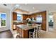 Modern kitchen featuring granite countertops, stainless steel appliances, and an island with seating at 10310 Coral Landings Ct # 98, Placida, FL 33946