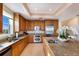 Well-equipped kitchen with stainless steel appliances, granite countertops, and a functional layout at 10310 Coral Landings Ct # 98, Placida, FL 33946