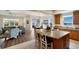 Open floor plan with a modern kitchen, dining area, and living room filled with natural light at 10310 Coral Landings Ct # 98, Placida, FL 33946