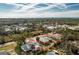 Lovely coastal home with an expansive yard, partially fenced-in, and lush greenery surrounding the property at 1080 Panda Rd, Venice, FL 34293