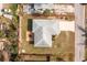 Overhead shot of home with patio, and large yard surrounded by a neighborhood at 1080 Panda Rd, Venice, FL 34293