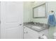 Updated bathroom with granite countertops, a framed mirror, and a white vanity at 1080 Panda Rd, Venice, FL 34293