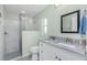 Modern bathroom featuring a glass-enclosed shower and a vanity with granite counters at 1080 Panda Rd, Venice, FL 34293