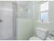 Modern shower featuring decorative tiling, updated shower head, and glass enclosure at 1080 Panda Rd, Venice, FL 34293